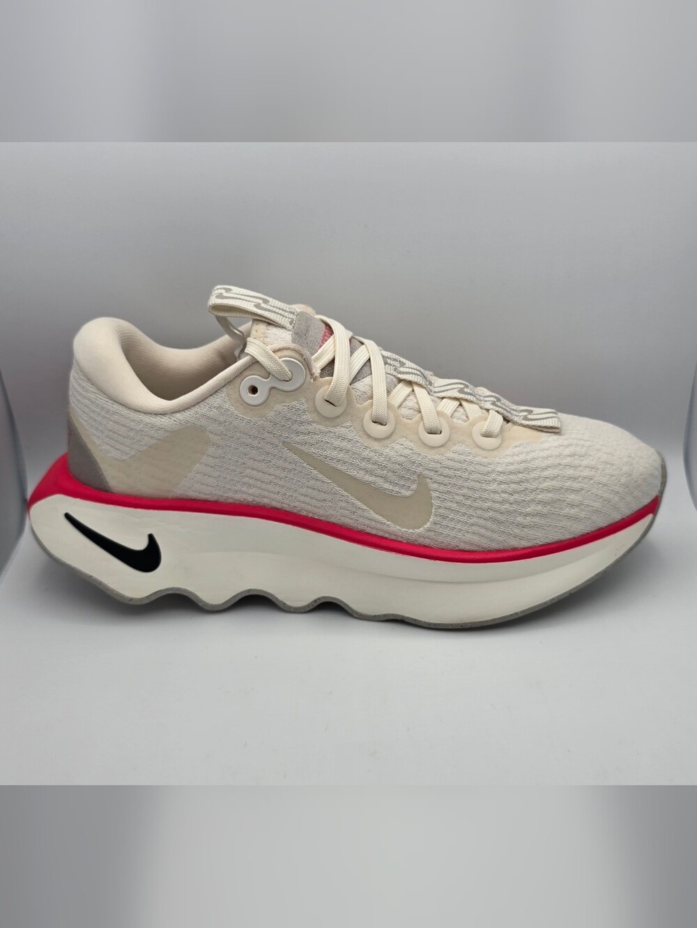 Nike Women’s Motiva Cream Running Shoe with Pink Accent